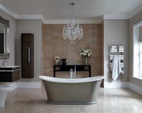 Small crystal chandelier installed in a bathroom; damp-rated safety