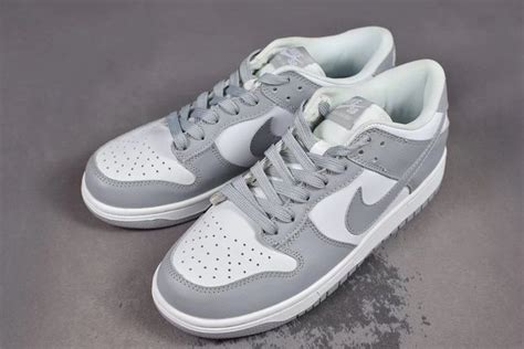 grey and white nike shoes