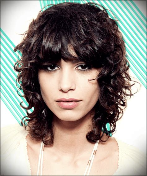 layered curly hair with bangs