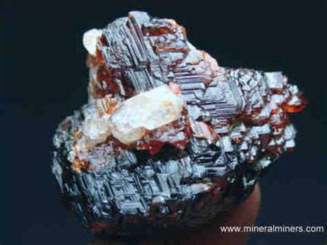 natural spessartine garnet in matrix