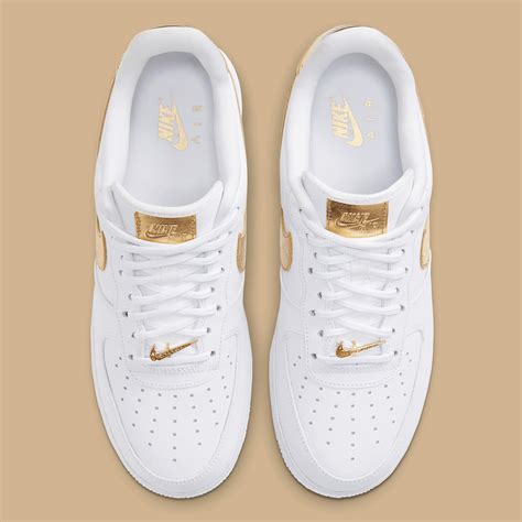 nike gold white shoes