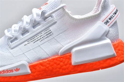 nmd r1 orange white