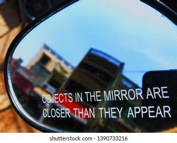 objects in a mirror are closer than they appear