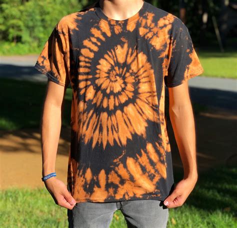 orange and black tie dye shirt