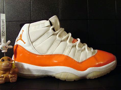 orange and white jordan 11