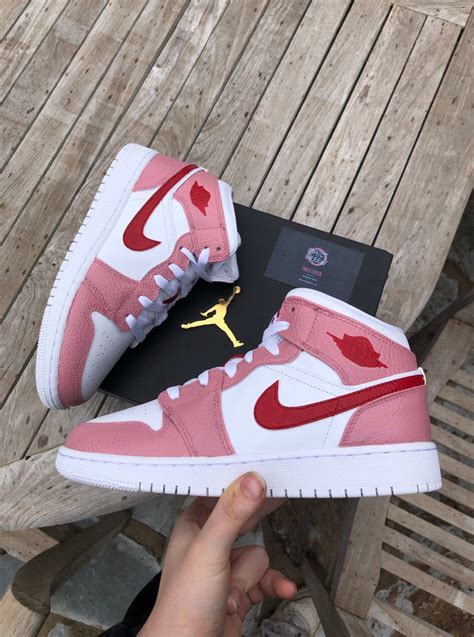 pink and red jordans