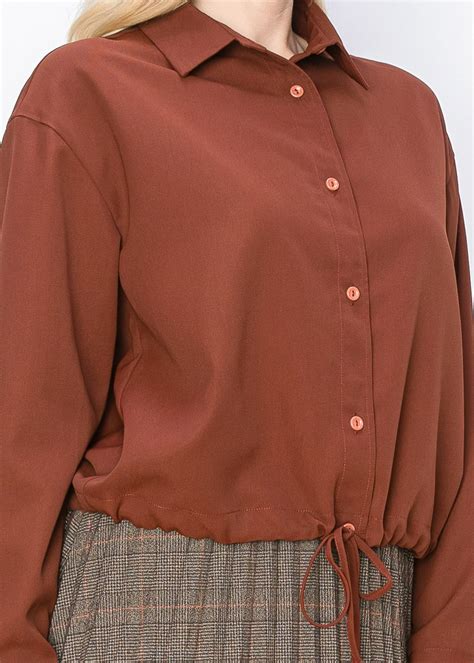 rust colored shirt