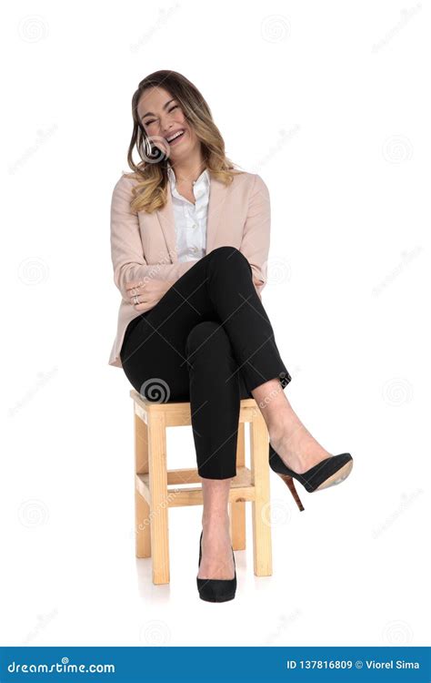 sitting cross legged on chair