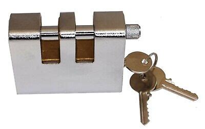 slotted piece that fits behind a padlock