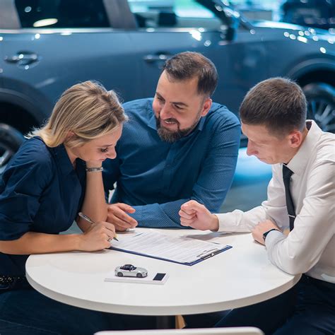 Student and parent discussing car financing options with a cosigner