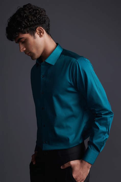 teal green shirt