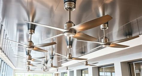 Homeowner testing a newly installed ceiling fan for wobble and noise in renovated room