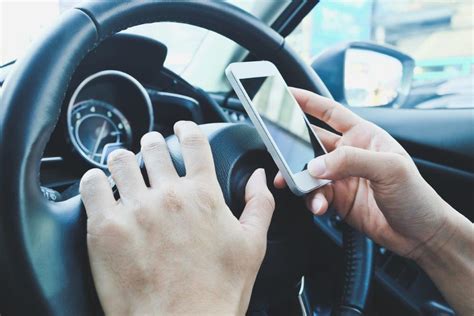 using mobile phone while driving demerit points singapore