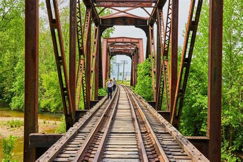 walking along river on tracks Reader