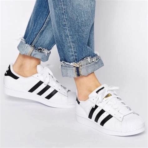 white and black striped adidas shoes